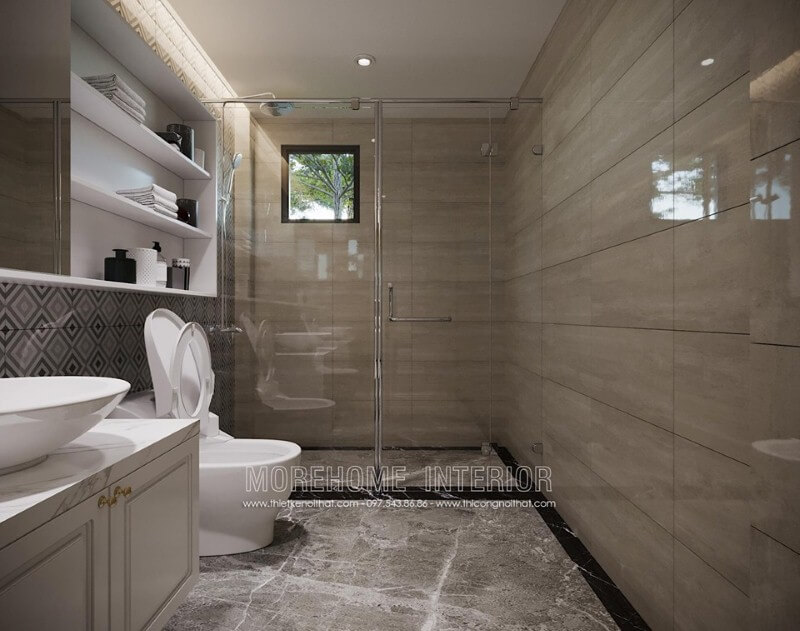 Gạch ốp tường giả vân gỗ kết hợp vách tắm kính cường lực trong suốt tạo cảm giác rộng rãi, thông thoáng cho phòng tắm. Mẫu nội thất biệt thự đẹp