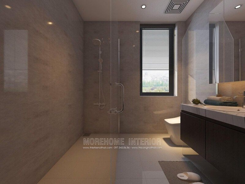 Sắp xếp nội thất phòng tắm nhỏ đẹp sang trọng với vách tắm kính 135 độ song song với không gian vệ sinh từ tủ, gương và bồn cầu.